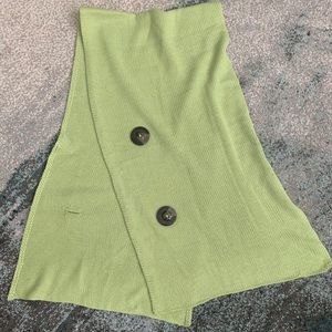 Light green wrap/scarf with button closure. NWOT.